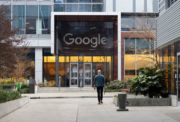 Seattle, WA, USA - Dec 21, 2023: A Googler walks back to Google's South Lake Union office in Seattle, Washington