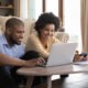 a man and woman learning Entrepreneurship online with BOBs from their home laptop