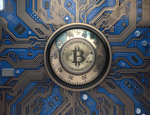 Bitcoin cryptocurrency security and mining concept safe lock with symbol of bitcoin on circuit board